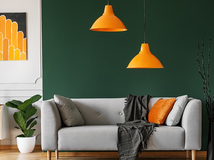 living room couch and orange light fixtures